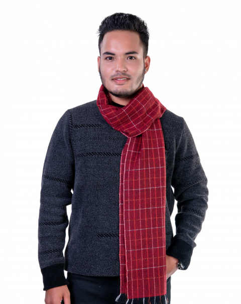 Rich red herringbone cashmere scarf, showcasing its fine woven design and warmth.