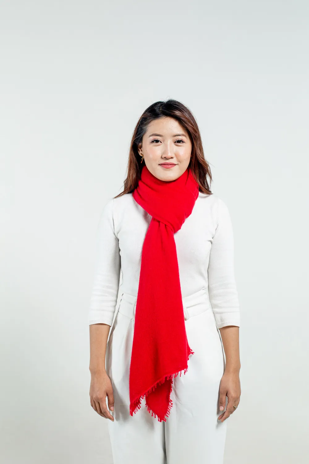 woman wearing a molten lava felted cashmere scarf tied in a simple loop knot.