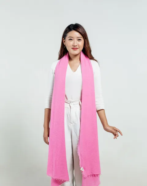 woman styling powder pink 100% cashmere scarf.