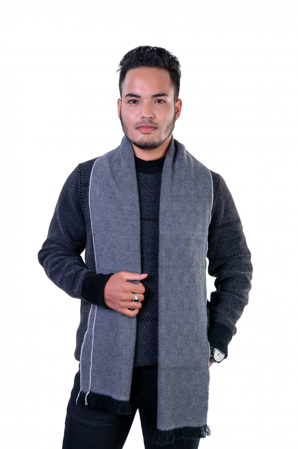 Gray herringbone cashmere scarf for men, worn over a dark sweater, showcasing a stylish winter accessory.