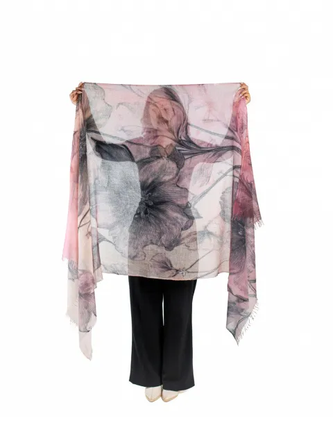 model displaying detailed floral design in featherlight cashmere wrap