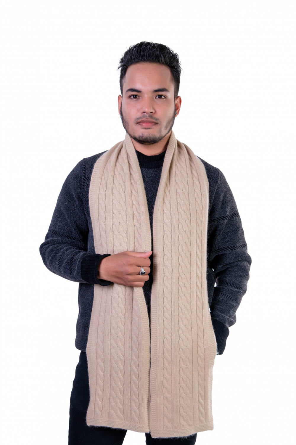 Luxurious beige cable-knit cashmere scarf with a soft, high-quality texture.